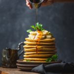 Sweet Delight: Drizzling honey over perfect pancakes